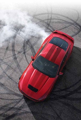 Overhead view of a 2024 Ford Mustang® model with tire tracks on pavement | Family Ford of Bluffton in Bluffton IN