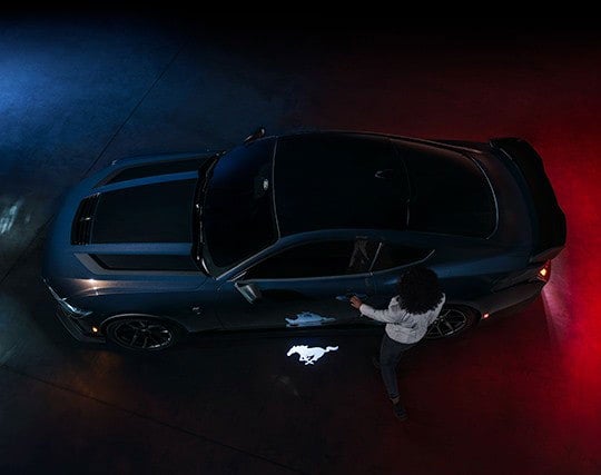 2024 Ford Mustang® Dark Horse™ model with a driver approaching the vehicle | Family Ford of Bluffton in Bluffton IN