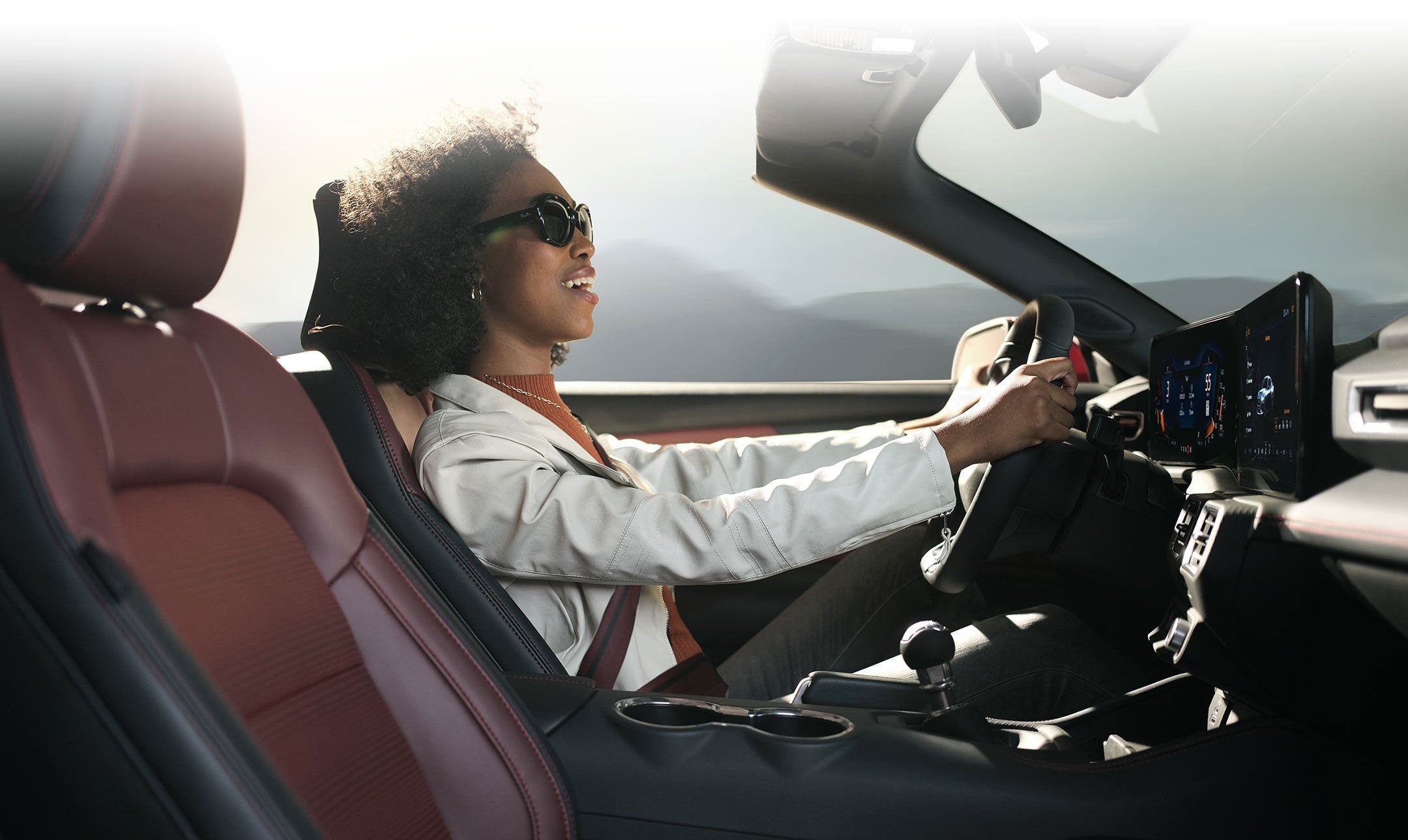 Person sitting in the driver’s seat of a 2024 Ford Mustang® convertible | Family Ford of Bluffton in Bluffton IN