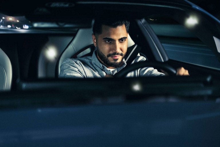 Person sitting in the driver’s seat of a parked 2024 Ford Mustang® coupe | Family Ford of Bluffton in Bluffton IN