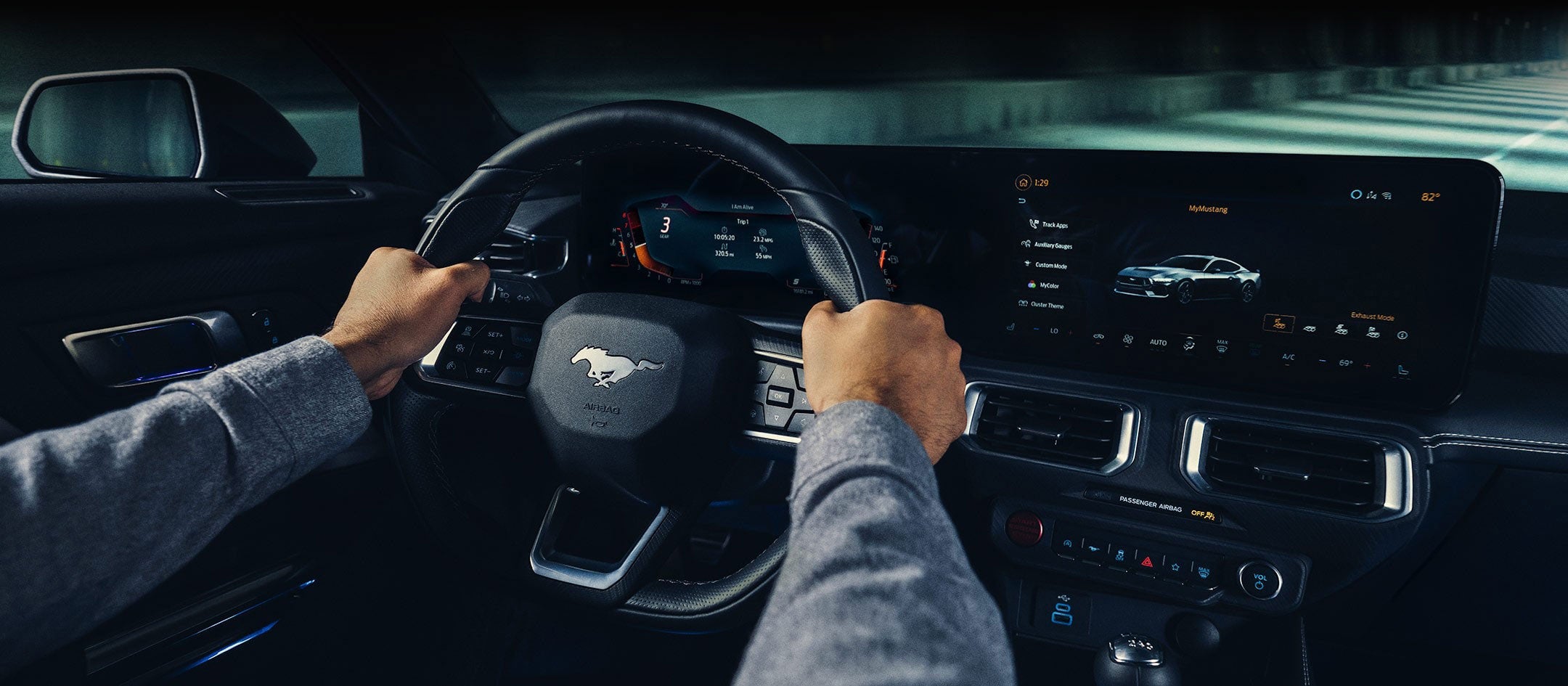 A 2024 Ford Mustang® model interior with a person driving | Family Ford of Bluffton in Bluffton IN